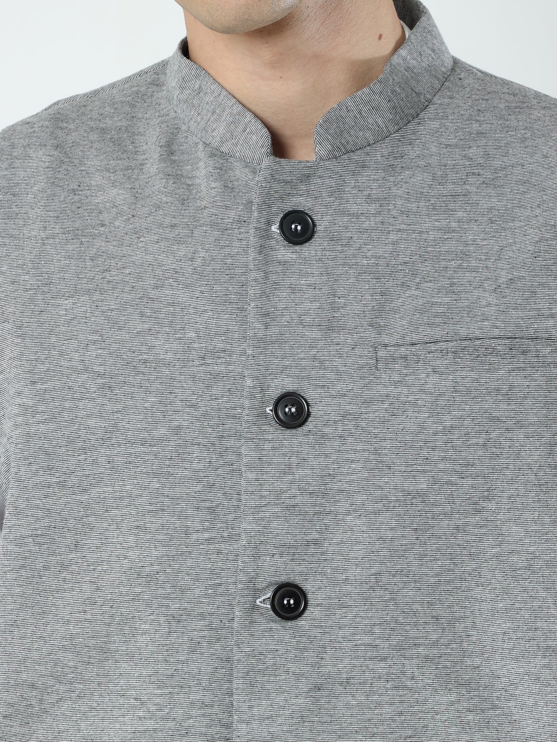 Button-front detailing on Sustainable Cotton Modi Coat Black
