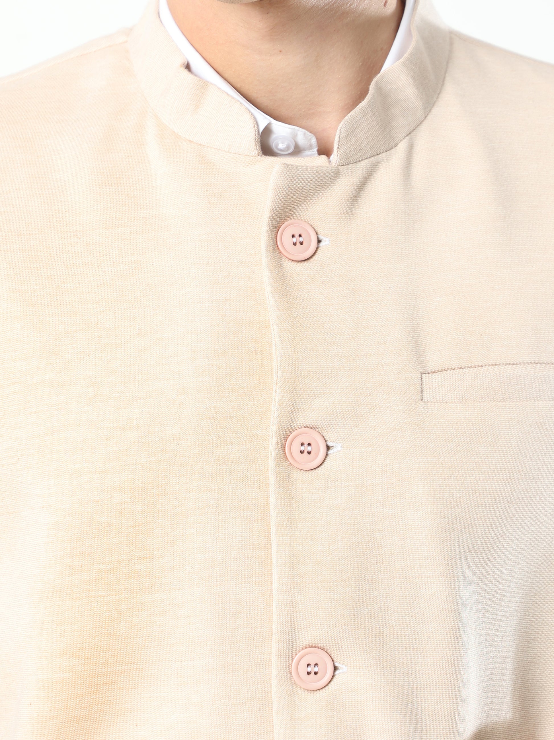 Button-front detailing on Sustainable Cotton Modi Coat Chandan
