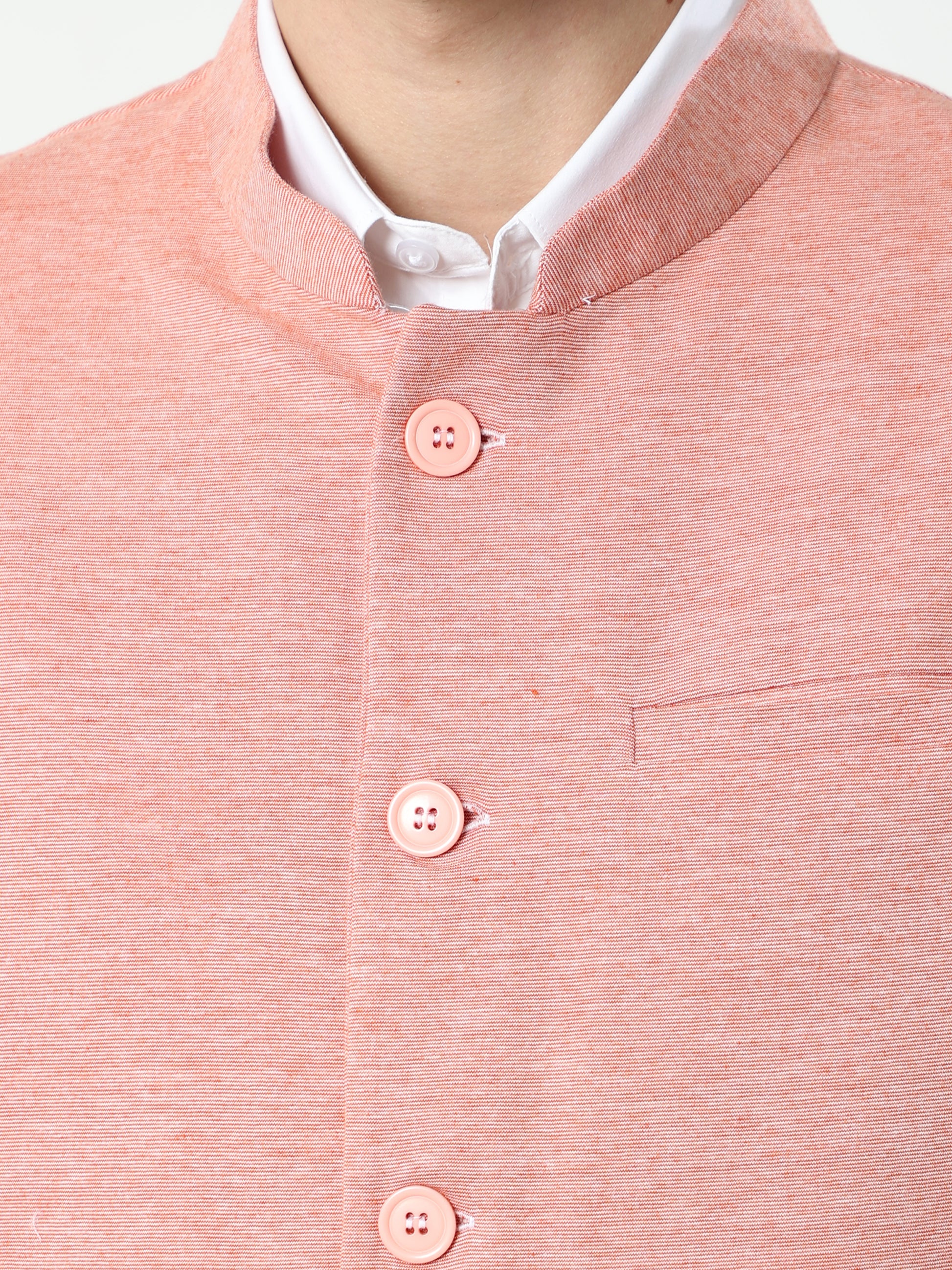 Button-front detailing on Sustainable Cotton Modi Coat Scarlet
