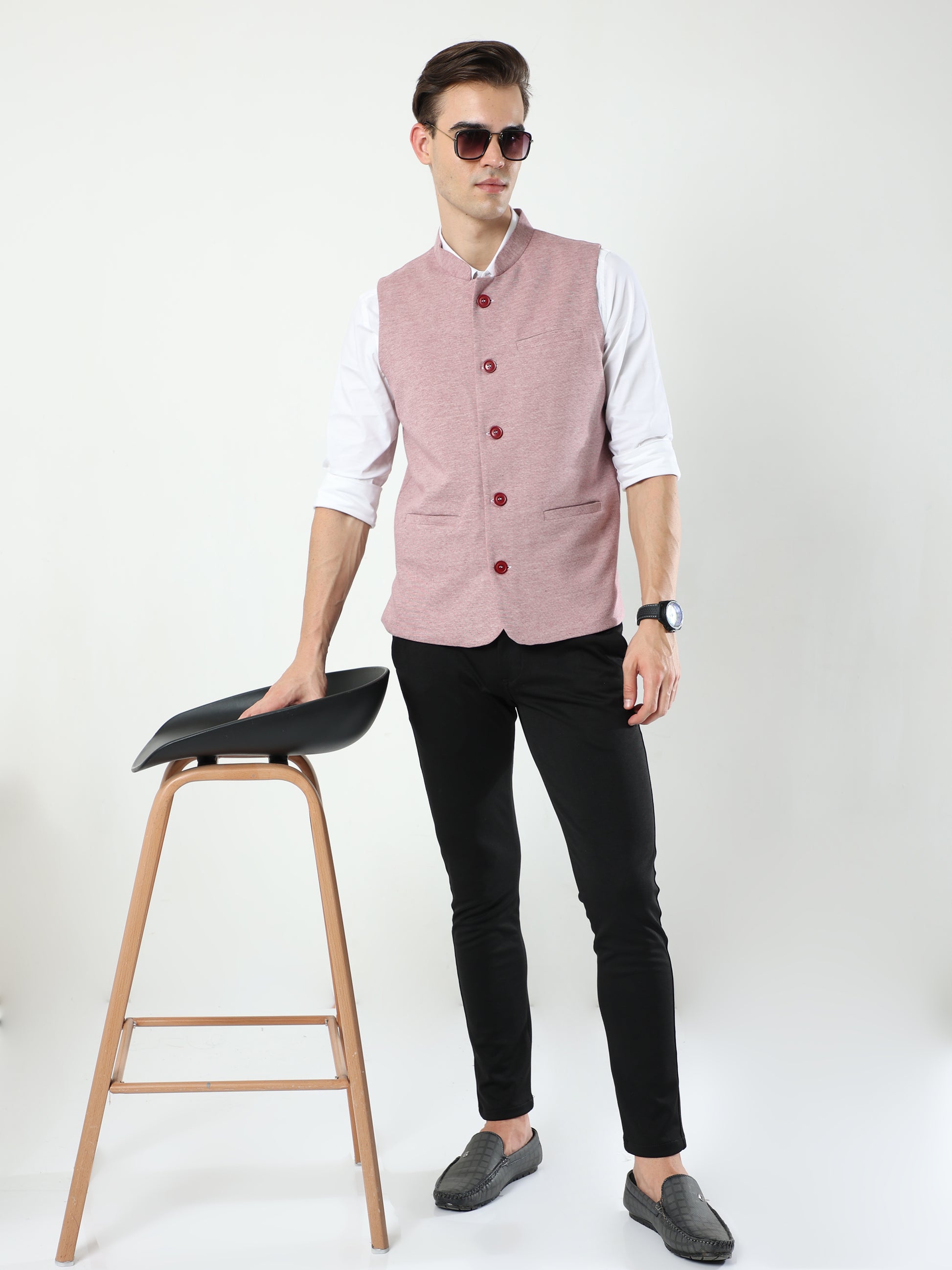 Lifestyle shot of model wearing Sustainable Cotton Modi Coat Maroon