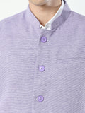 Button-front detailing on Sustainable Cotton Modi Coat Jamun
