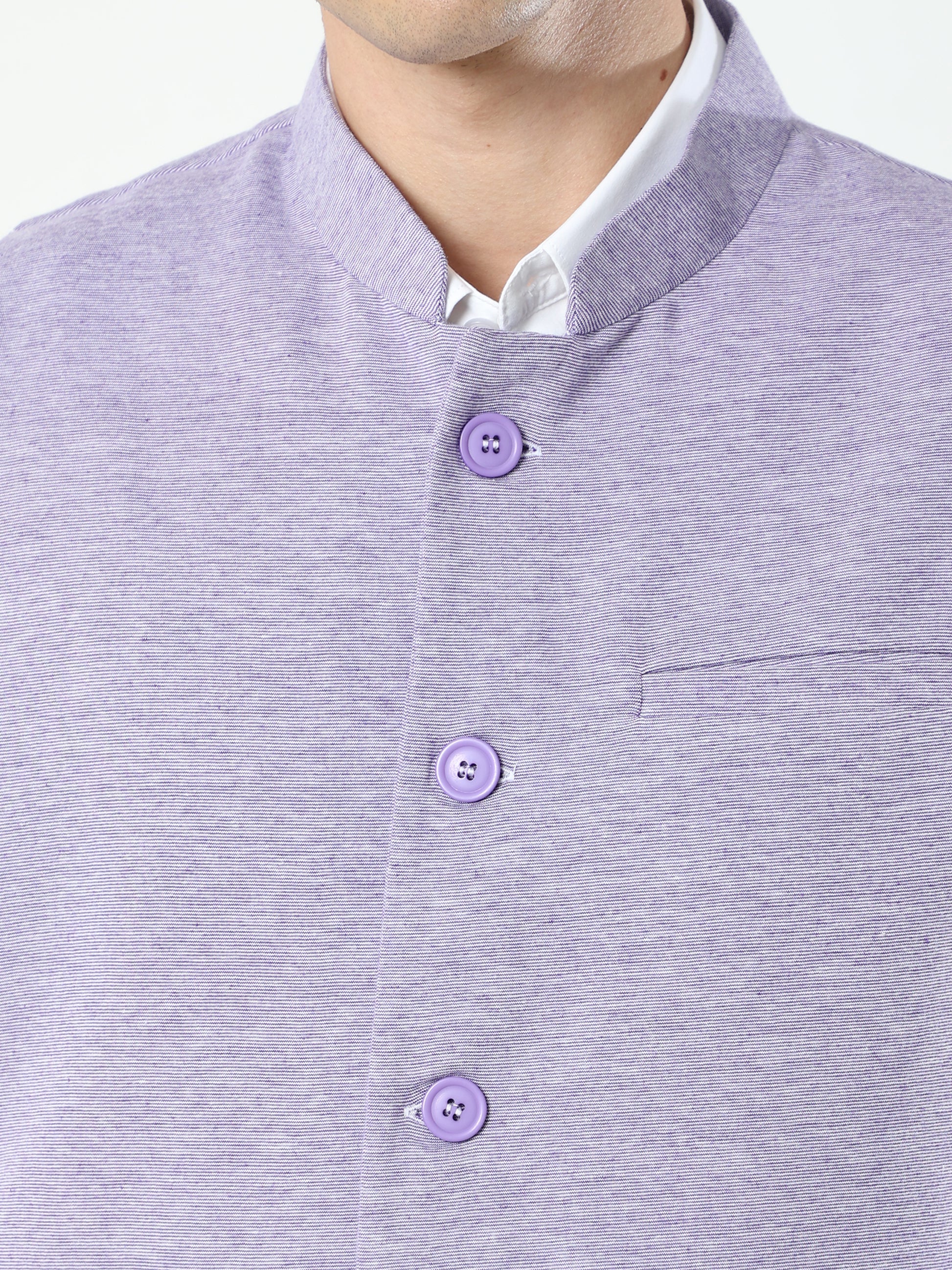Button-front detailing on Sustainable Cotton Modi Coat Jamun
