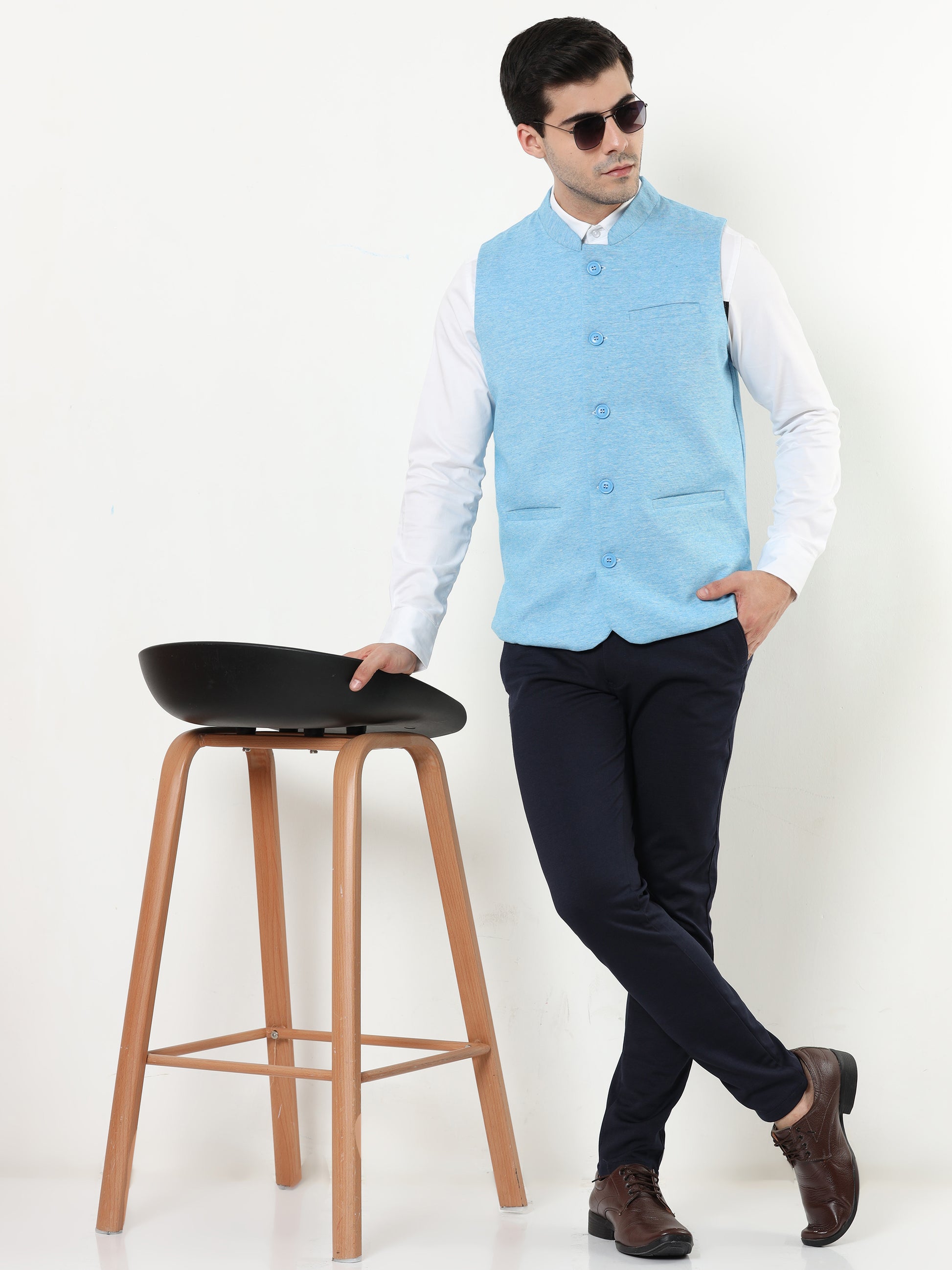 Model wearing Men’s Sustainable Cotton Modi Coat Cyan styled with kurta
