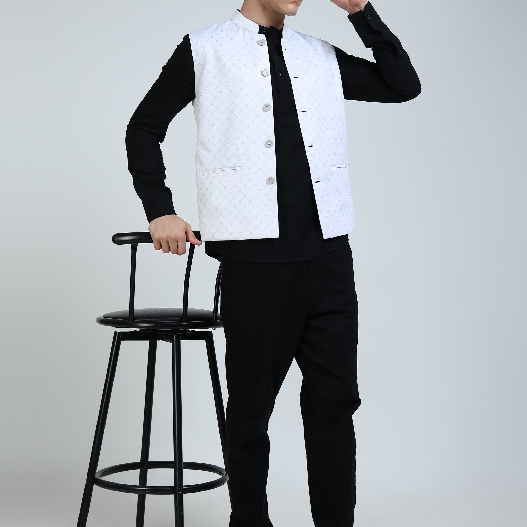 Side angle of model in Diamond Mesh Modi Jacket paired with kurta