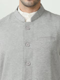 Button-front detailing on Sustainable Cotton Modi Coat Steel Grey
