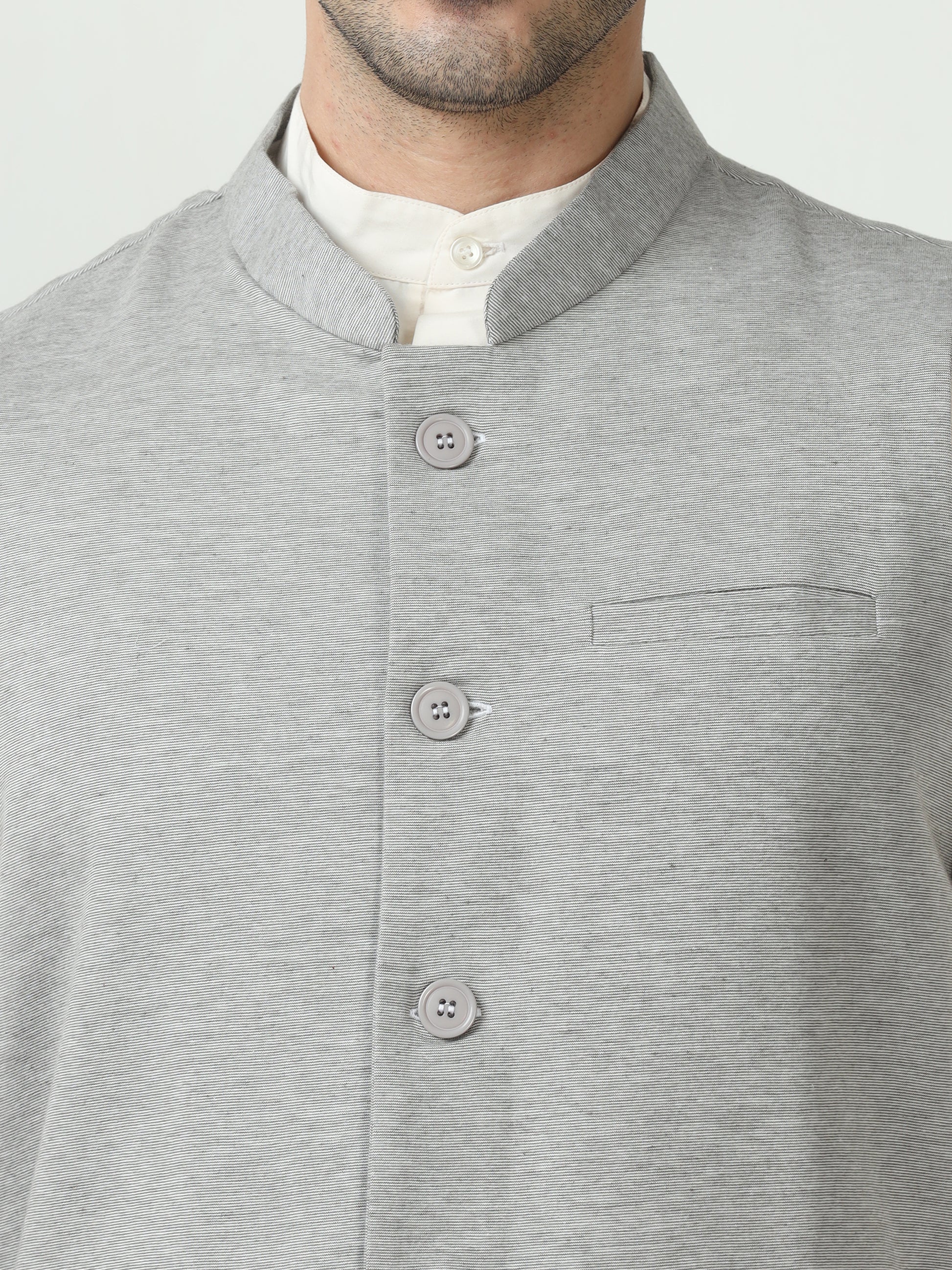 Button-front detailing on Sustainable Cotton Modi Coat Steel Grey
