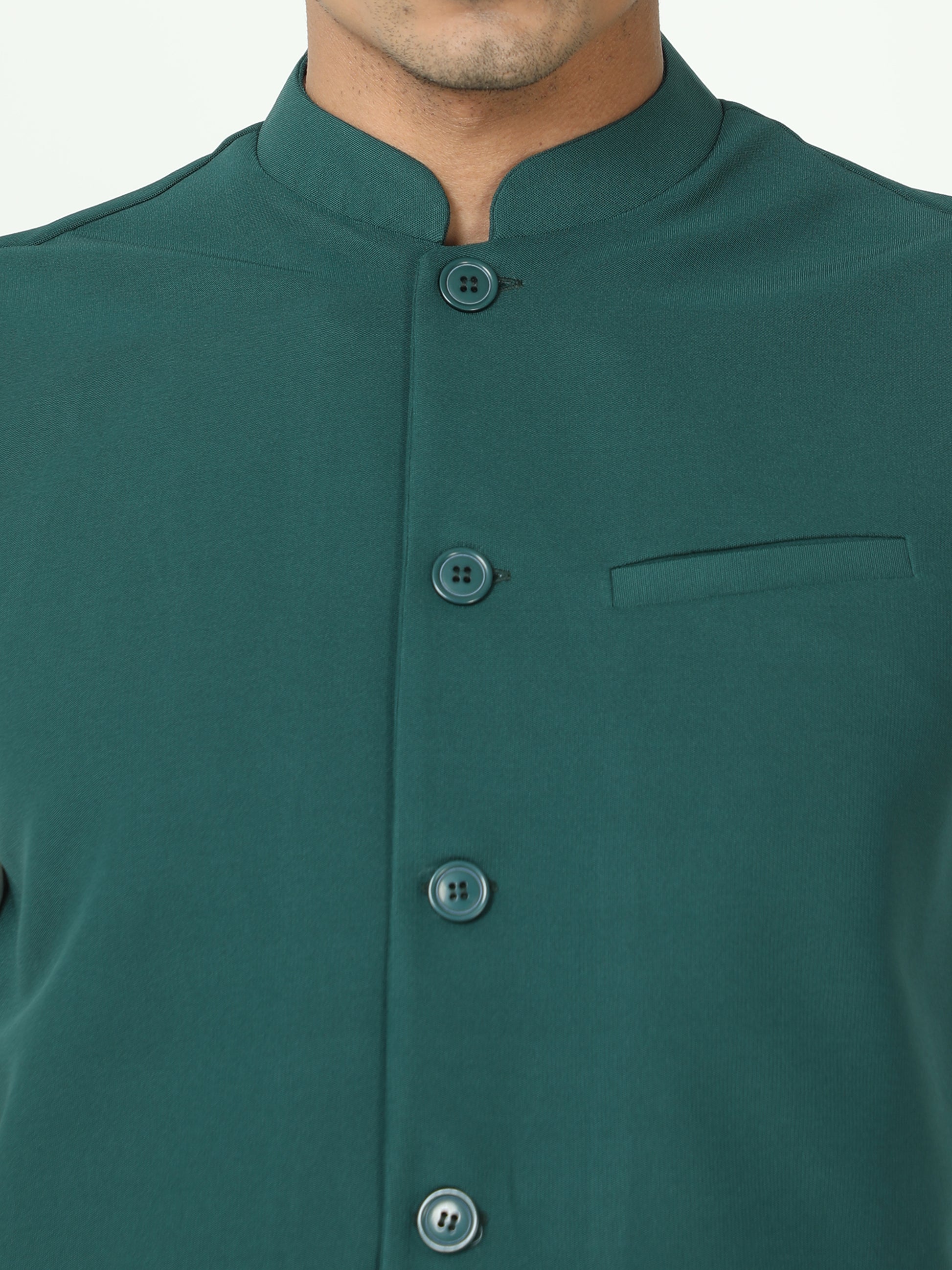 Button-front detailing on Solid Modi Coat Bottle Green
